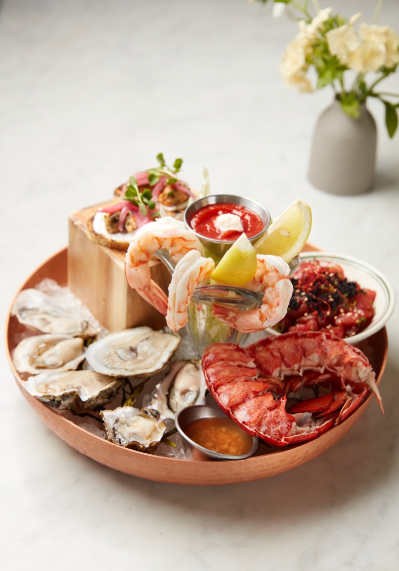 Seafood tower with lobster, shrimp, and oysters